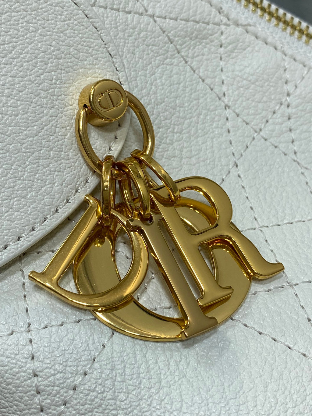 Dior bag gold-tone chain charm and hardware on white quilted leather