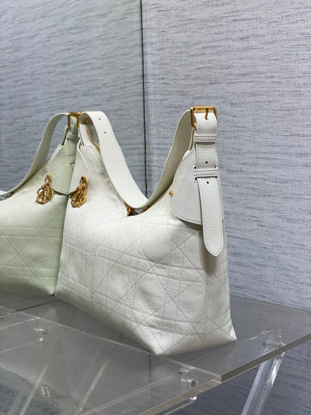 Dior hobo bag in white quilted leather with gold hardware and top strap