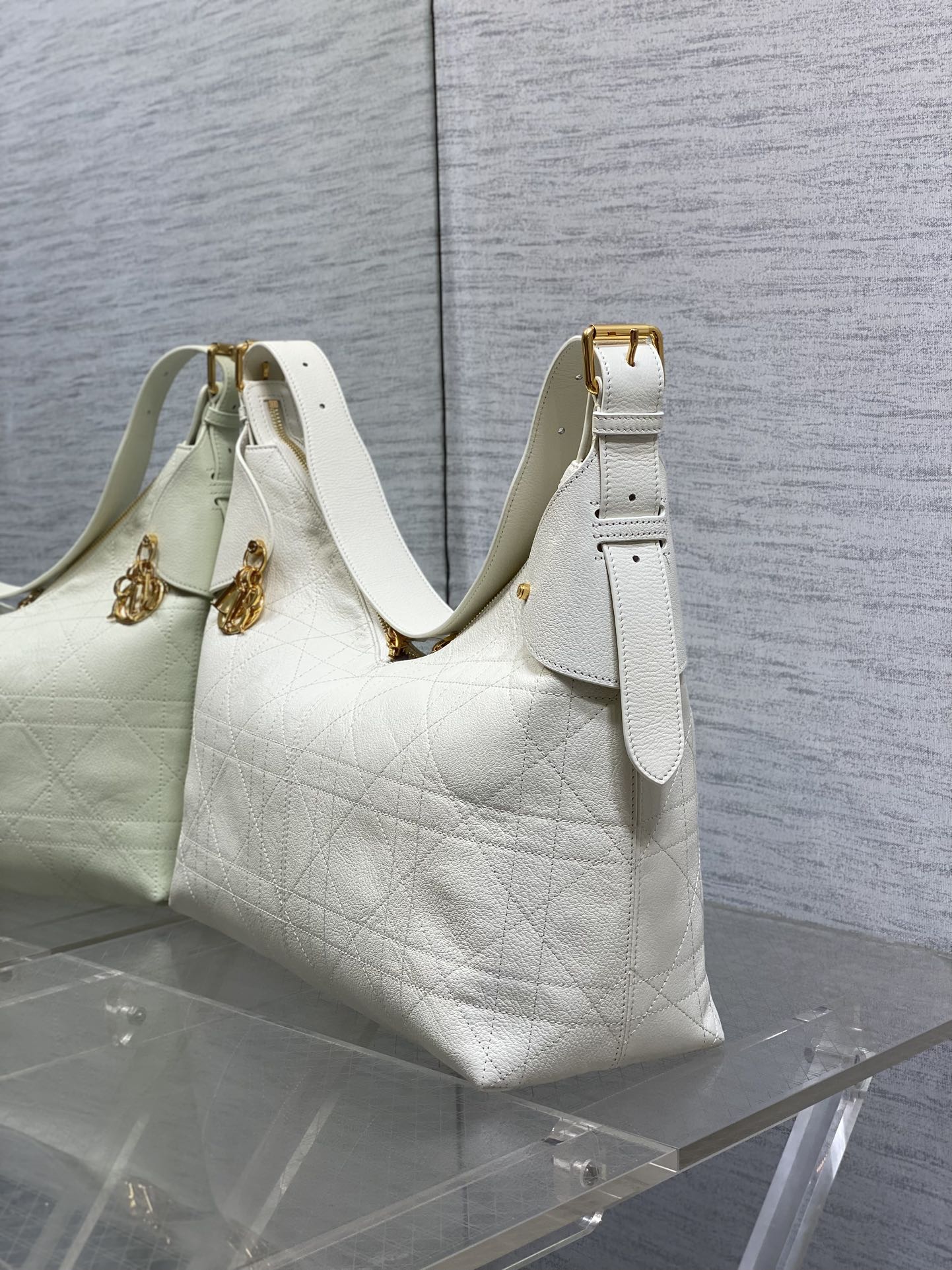 Dior hobo bag in white quilted leather with gold hardware and top strap
