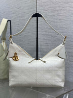 Dior hobo bag in white quilted leather with gold hardware, handles and shoulder strap