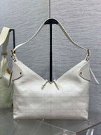 Dior hobo bag in white quilted leather with gold hardware, shoulder strap and top handles