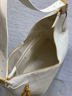 Dior bag open top with white leather, gold zipper and interior logo patch