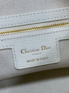 Dior bag interior label reading Christian Dior Paris, Made in Italy