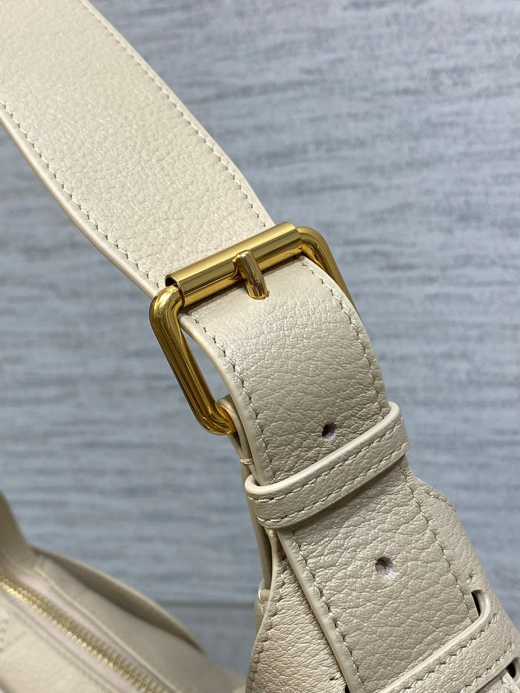 Dior bag strap with gold buckle and light beige textured leather