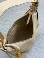 Dior bag interior view with light beige lining and gold-tone zipper hardware