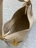 Cream leather bag interior with gold zipper and inner pocket