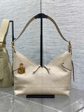 Hobo bag in cream quilted leather with gold-tone hardware and shoulder straps.