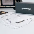 Clear-lensed eyeglasses with silver frame and patterned temple arms in black