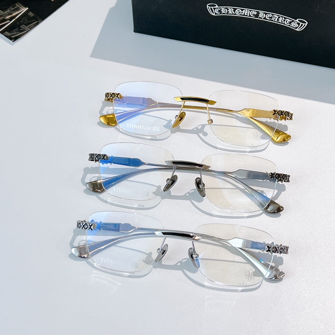 Eyeglass frames with tinted blue lenses in gold and silver, featuring patterned temples