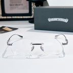 Silver eyeglasses with clear lenses and patterned temple tips