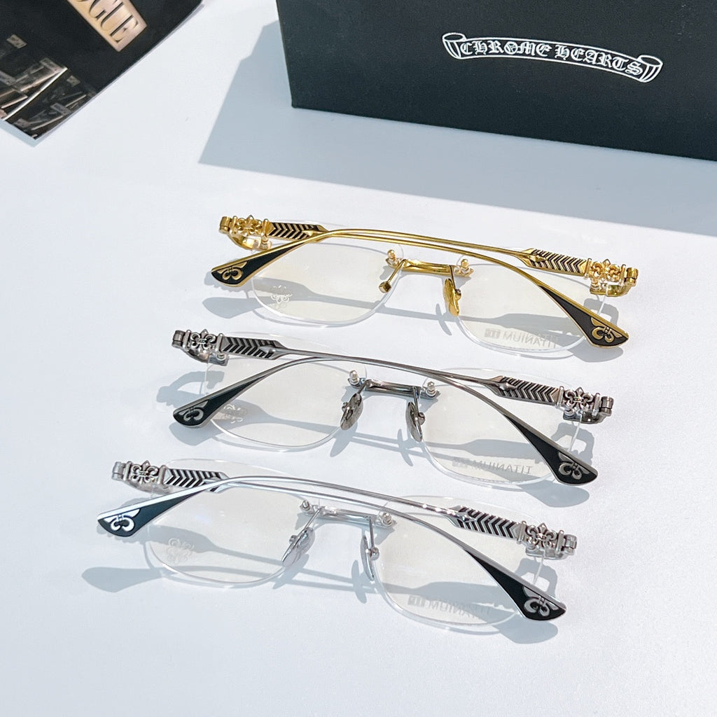 Assorted eyeglass frames in gold and silver with patterned temple arms and clear lenses