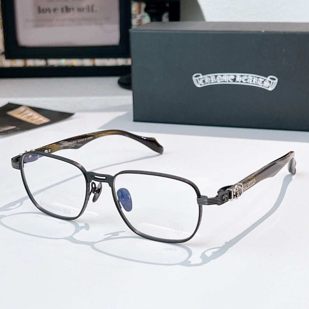Eyeglasses with dark frame, clear lenses, and brown patterned temples.