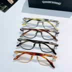 Set of four eyeglasses frames in metal with multicolor patterned temples.