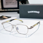 Eyeglasses with silver rectangular frame and gold-green patterned temples.