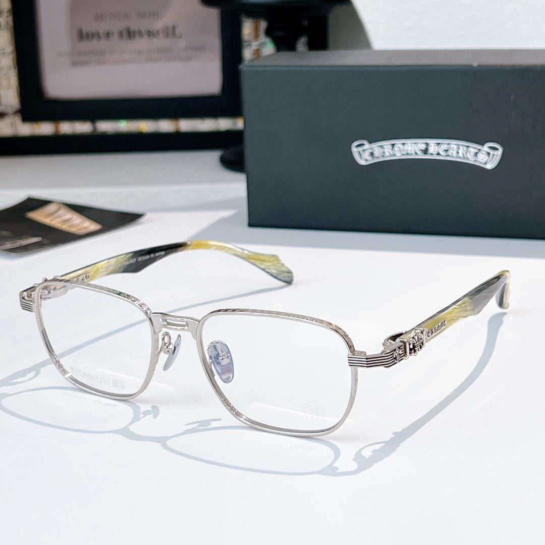 Eyeglasses with silver rectangular frame and gold-green patterned temples.