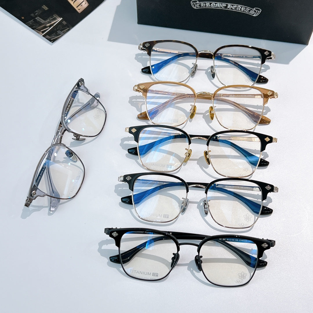 Set of eyeglasses with blue-tinted lenses, silver, gold, and black frames