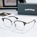 Round eyeglasses with black front frame and silver metal temples, clear lenses