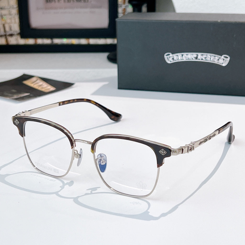 Round eyeglasses with silver metal frame and dark temples, clear lenses