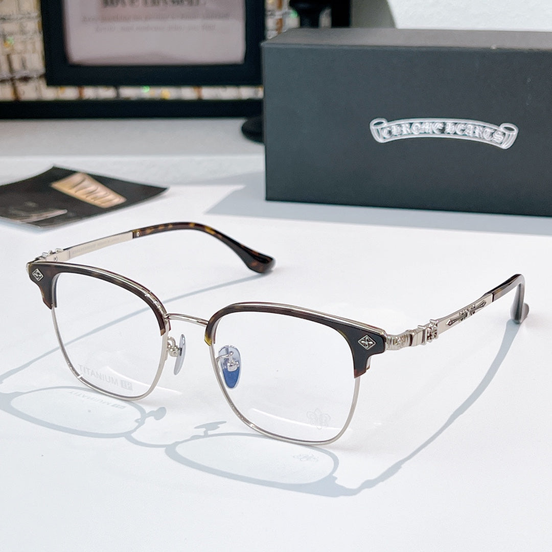 Round eyeglasses with silver metal frame and dark temples, clear lenses