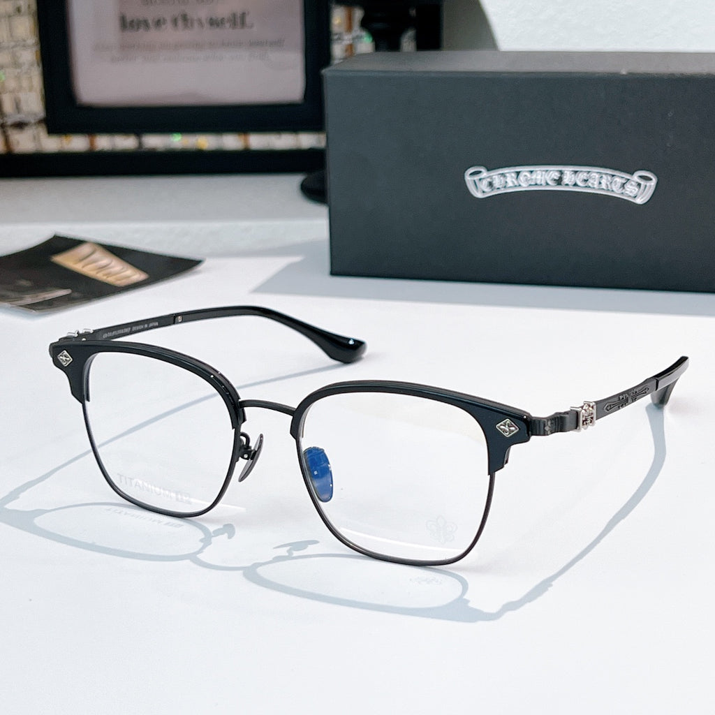 Round eyeglasses with black front frame, silver temple detail, clear lenses