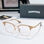 Round eyeglasses with gold metal frame, black temple tips, clear lenses