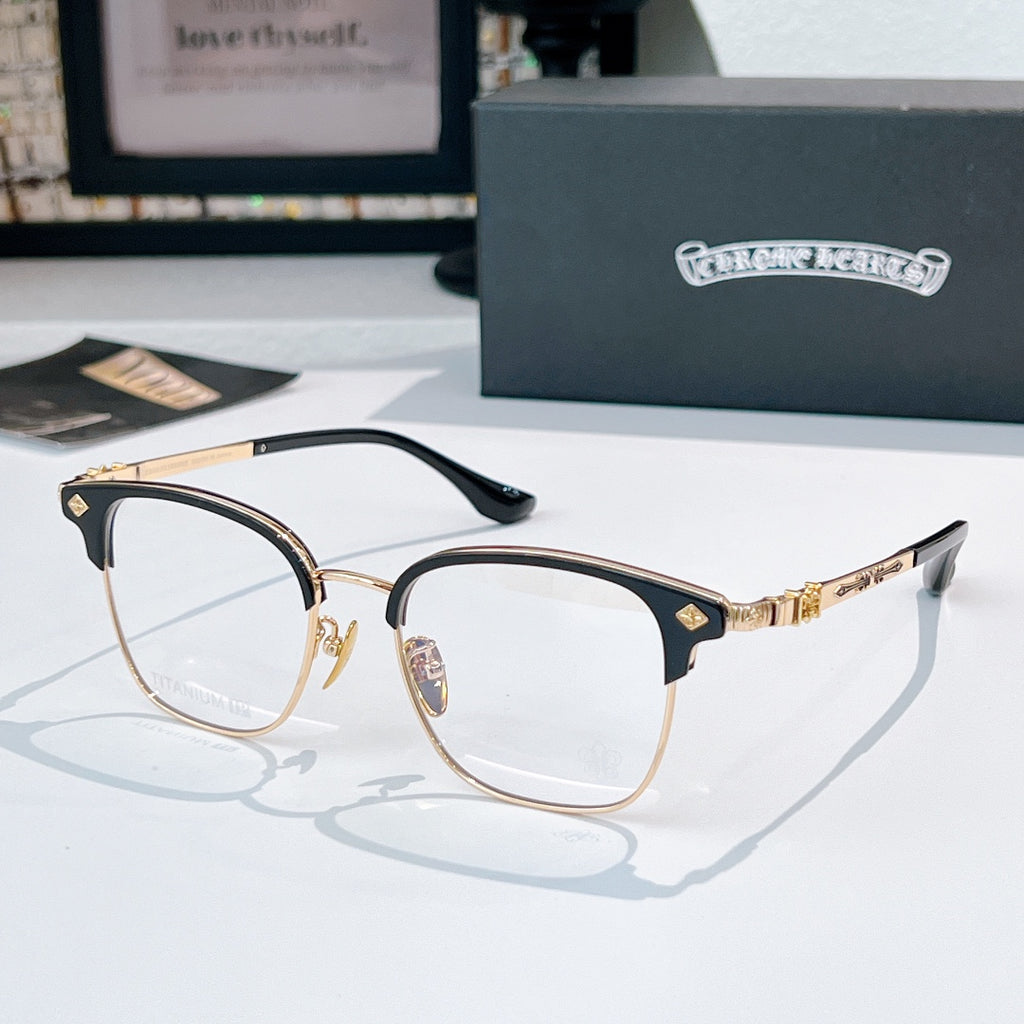 Round eyeglasses with gold metal frame and dark temple arms, clear lenses