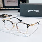 Round eyeglasses with gold metal frame and dark temple arms, clear lenses