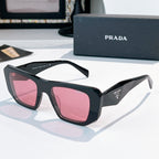 Prada sunglasses with dark frames and pink tinted lenses