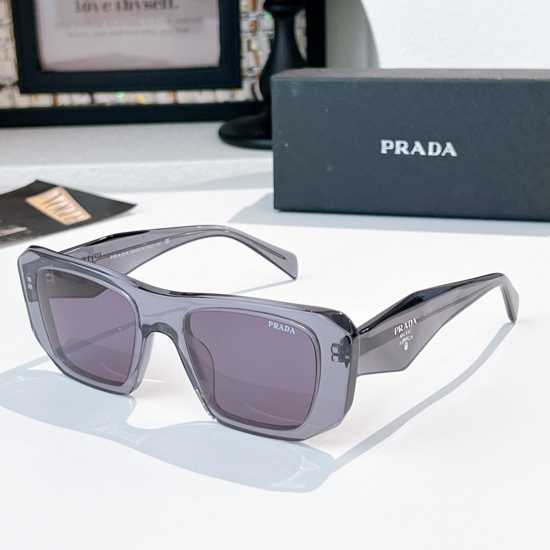 Prada sunglasses with gray frames and purple tinted lenses