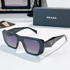 Prada sunglasses with black frames and purple tinted lenses