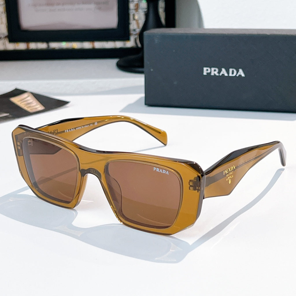 Prada sunglasses with brown frames and brown tinted lenses