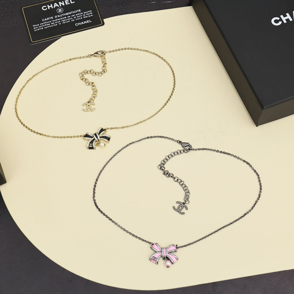 Two-tone necklace set: gold and silver chains with bow and pearl pendants