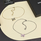 Two-tone necklace set: gold and silver chains with bow and pearl pendants