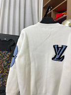 Off-white knit sweater back view with navy LV logo