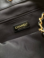 Chanel interior brand label reading CHANEL MADE IN ITALY on black lining