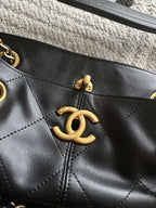 Chanel front CC charm on quilted leather bucket bag with gold hardware