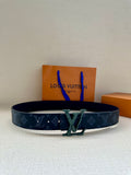 Monogram belt with dark blue strap and green buckle, adjustable holes