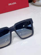 Prada dark blue square sunglasses with close-up lens and temple logo
