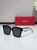 Prada black square sunglasses with thick acetate frames and dark lenses