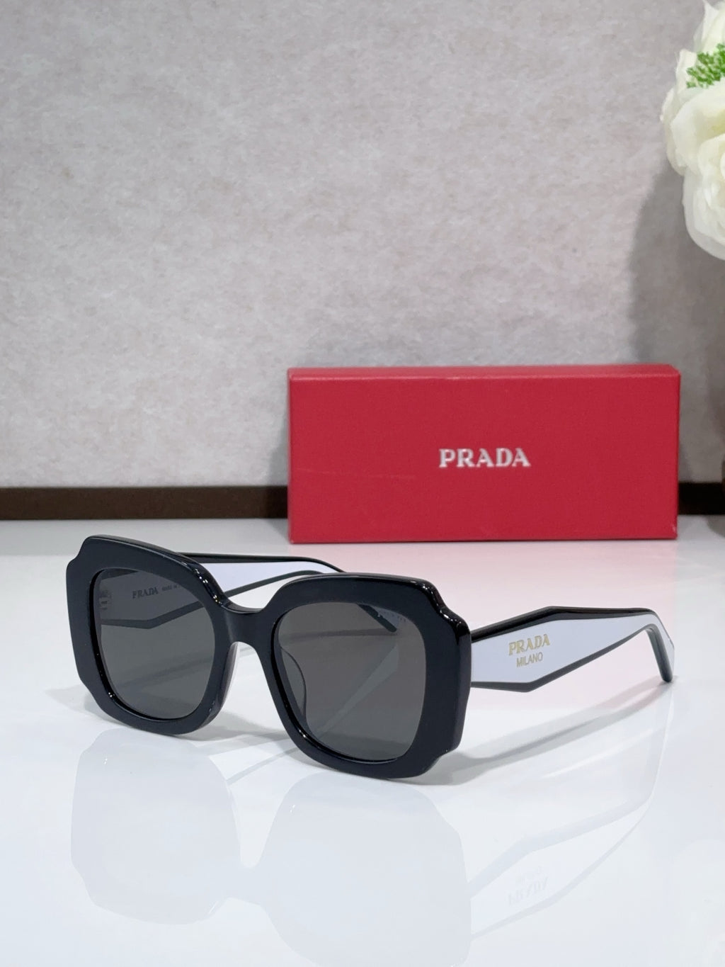Prada sunglasses, black frame with dark tinted lenses