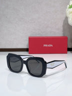 Prada sunglasses, black frame with dark tinted lenses