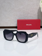 Prada sunglasses, black frame with dark gradient lenses