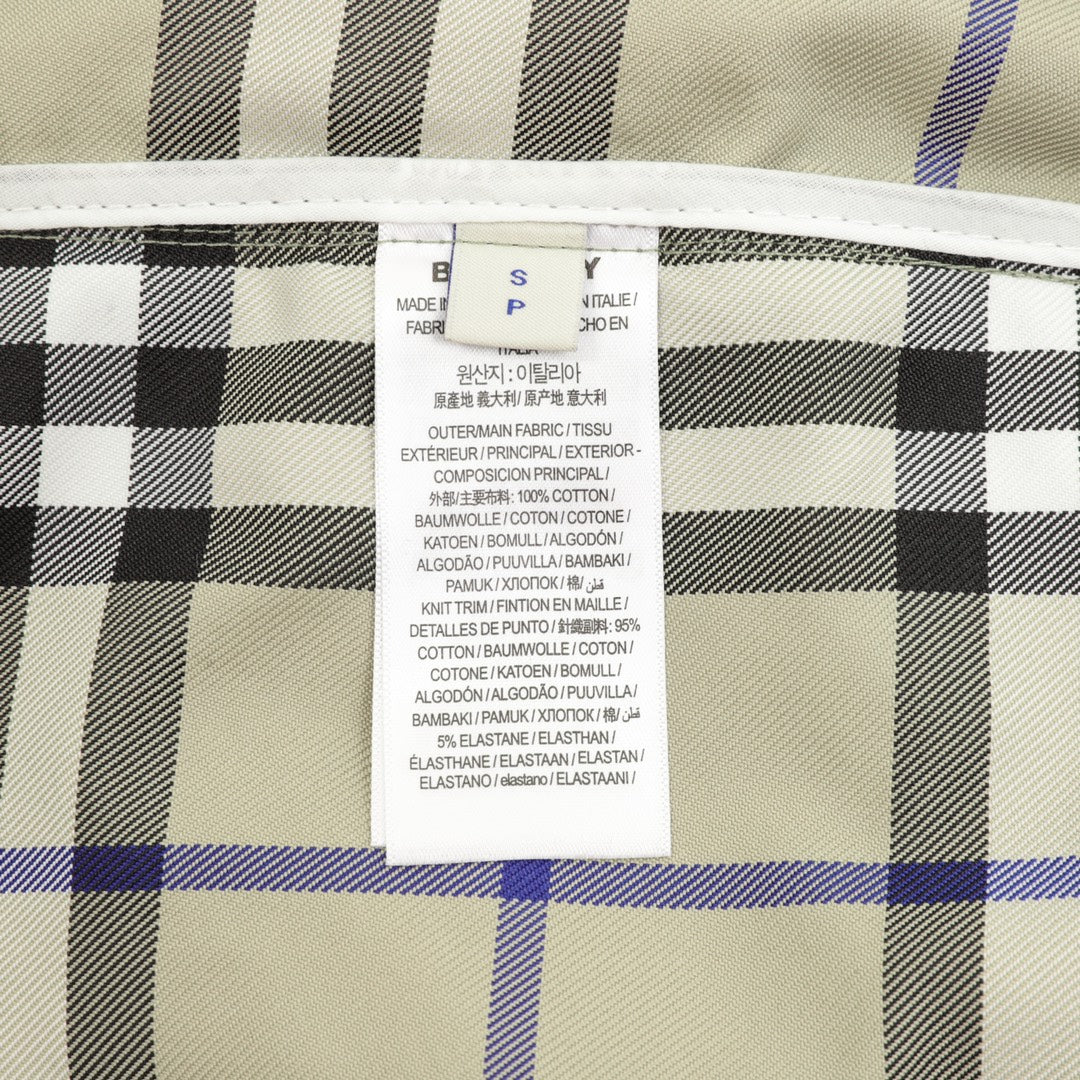 Plaid pants inner care label with fabric and composition text