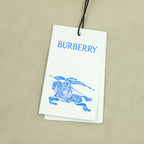 Burberry hang tag attached to beige pants with embroidered detail