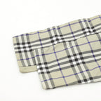 Cuffed pant leg with plaid outer panel and beige inner panel