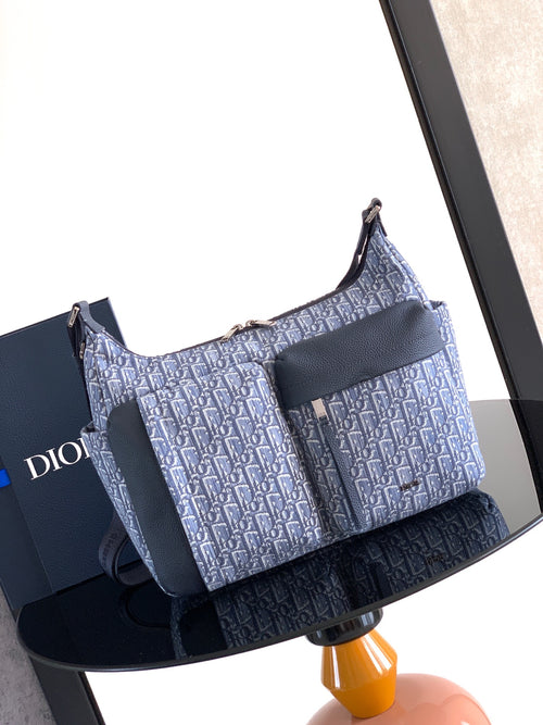 Dior men’s bag in light blue and navy with woven monogram and shoulder strap