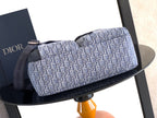 Dior men’s bag in light blue monogram canvas with navy top handle