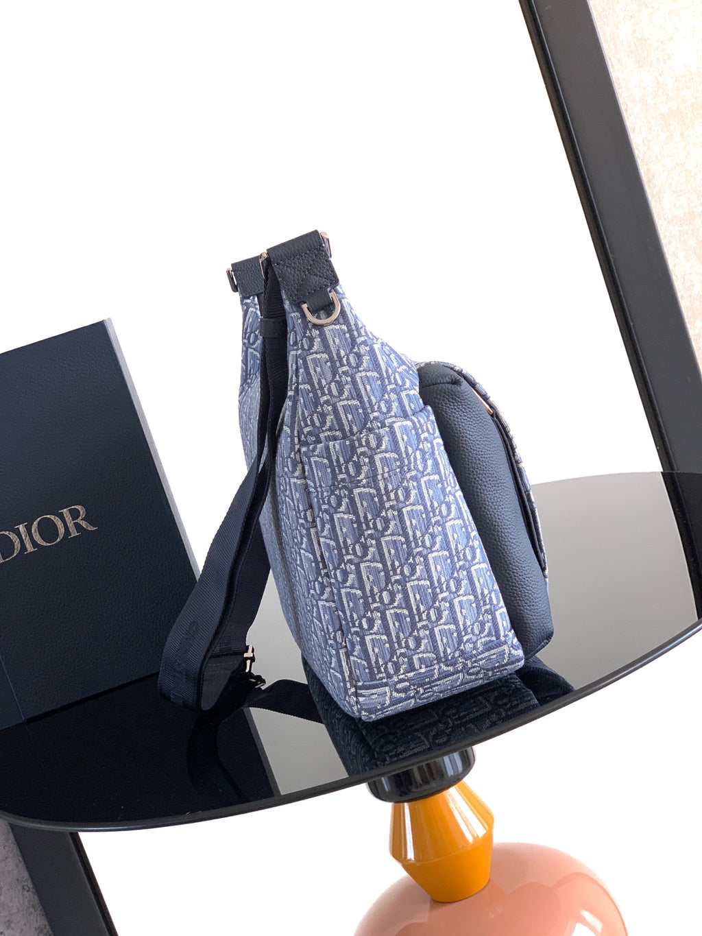 Dior men’s bag with light blue monogram canvas and navy dual straps