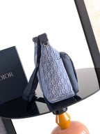 Dior small crossbody bag in light blue logo canvas with dark blue webbed strap