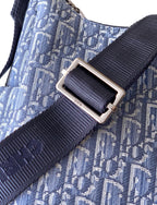 Dior strap buckle on light blue monogram bag with dark blue grosgrain strap